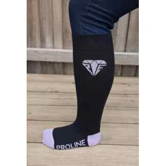 Freedom wide calf riding socks in black and lilac, showing stretch fit and logo detail on the lower leg